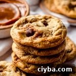 A stack of dulce de leche cookies with chocolate chips.