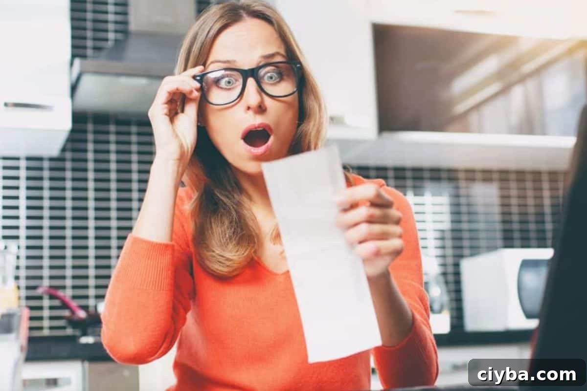 Woman looking at grocery bill in shock 