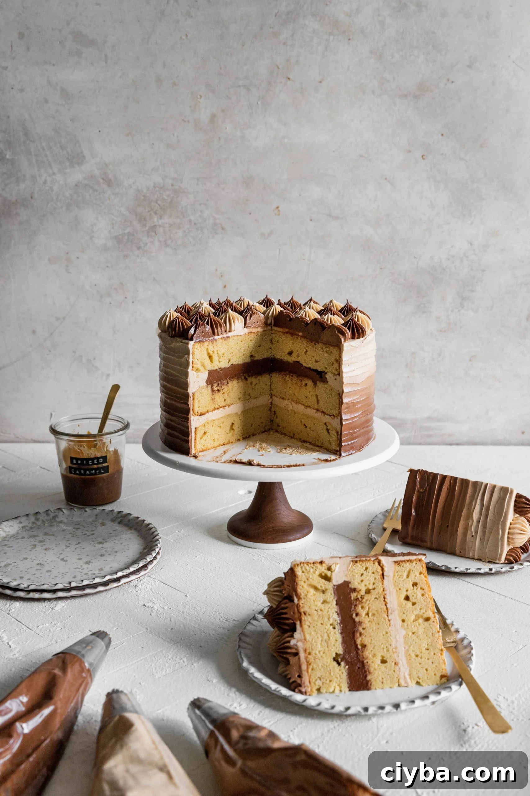 apple cider layer cake with spiced salted caramel swiss meringue buttercream