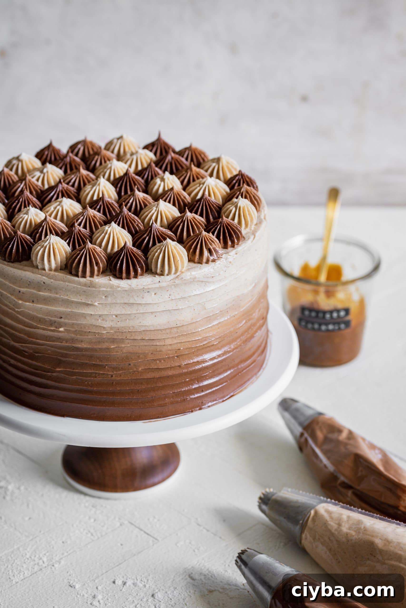 apple cider layer cake with spiced salted caramel swiss meringue buttercream