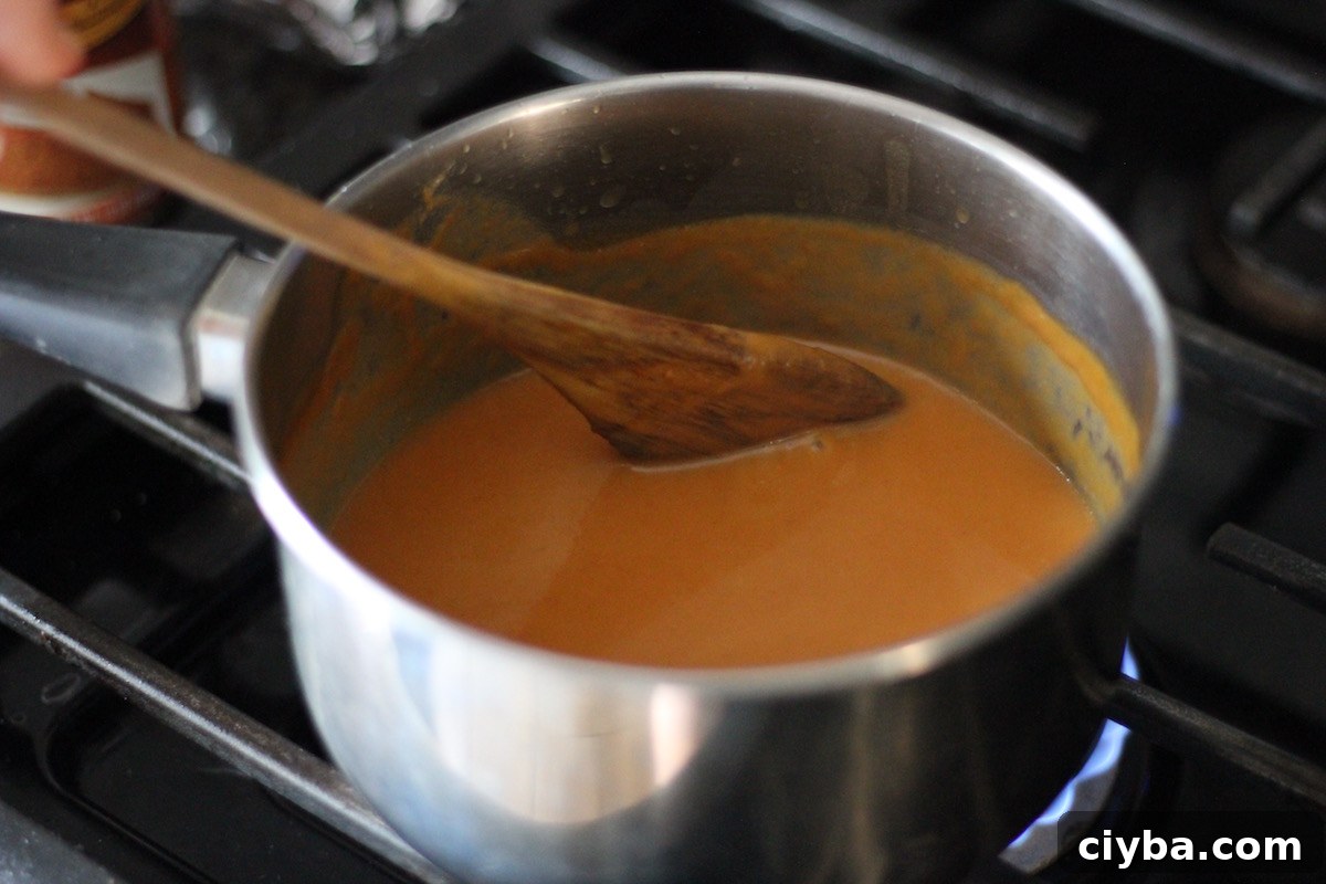 Pumpkin Salted Caramel Sauce - a dairy-free, sea salt caramel with a hint of pumpkin and spice! SO good on apples or just about anything! | feddandfulfilled.com