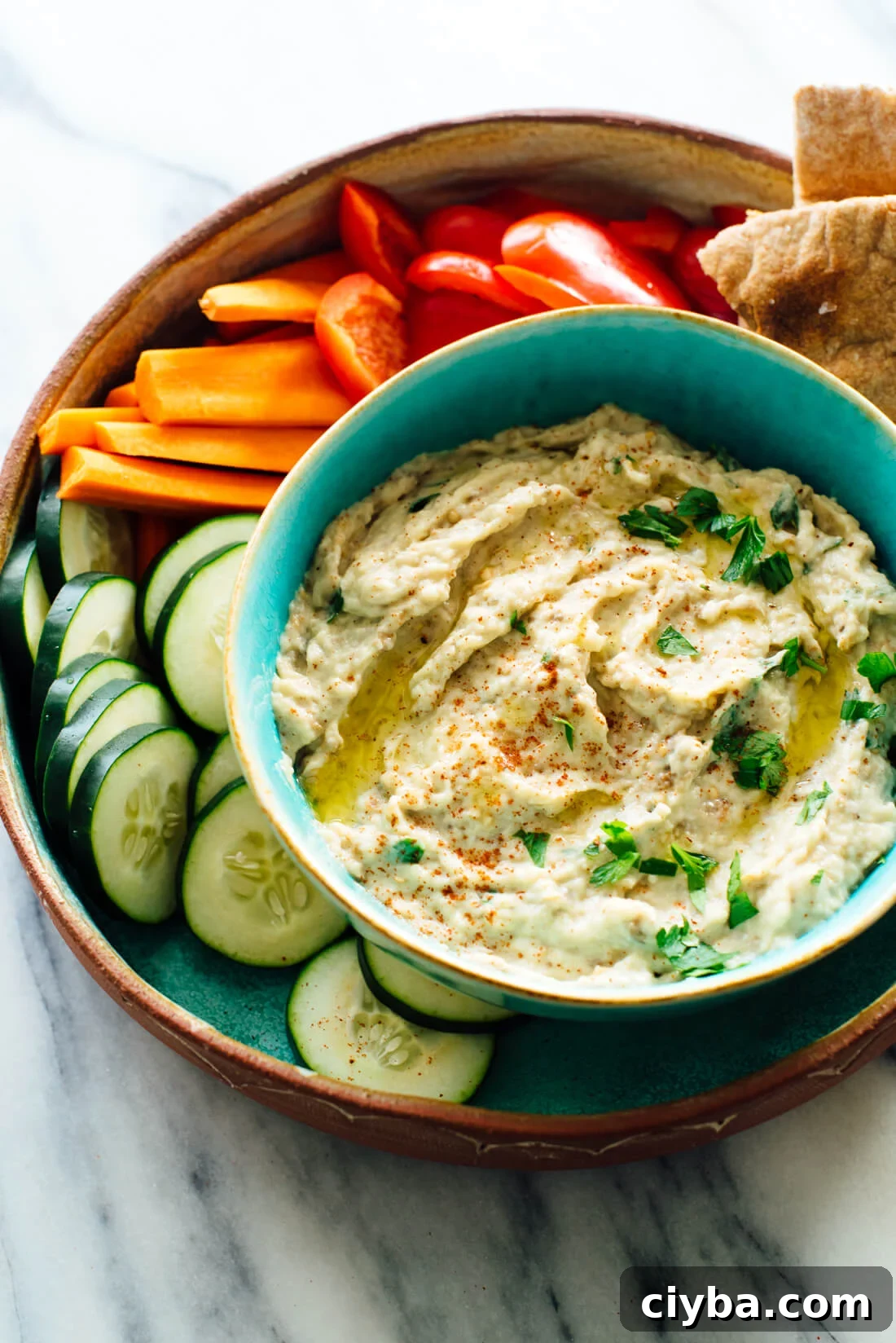 Smoky Baba Ganoush Recipe: Authentic Middle Eastern Eggplant Dip 2 The best baba ganoush recipe, made with oven-roasted eggplant, tahini, olive oil, lemon juice and garlic!