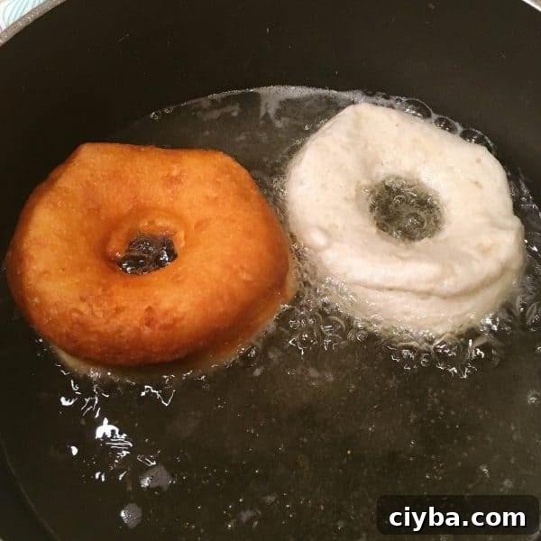 Grand's Quick Donuts: Simple Homemade Donut Recipes 5 Grand Biscuit Donuts frying in hot oil