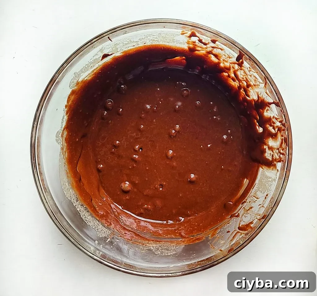 add in the melted chocolate and butter