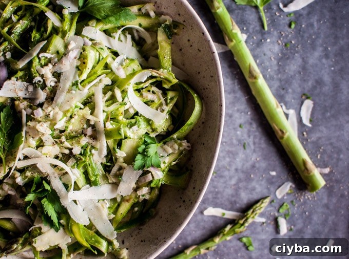 close-up of shaved asparagus salad with parmesan in a bowl