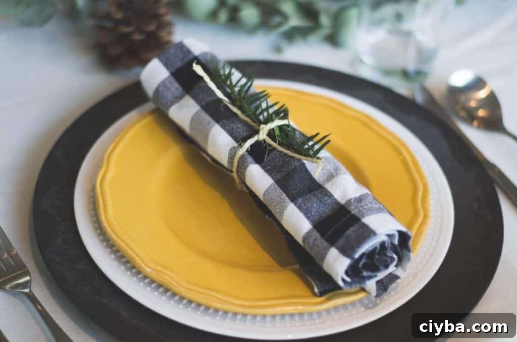 Photo by Libby Penner on Unsplash. Black and yellow holiday tablescape.