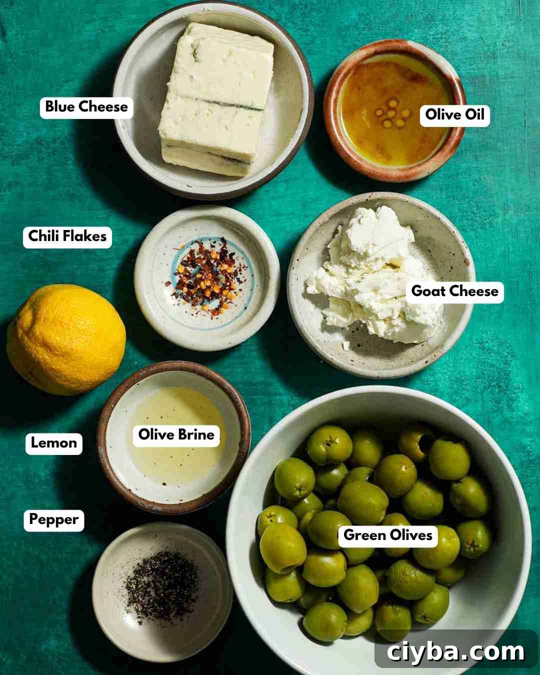 All the ingredients you need laid out for blue cheese stuffed green olives.