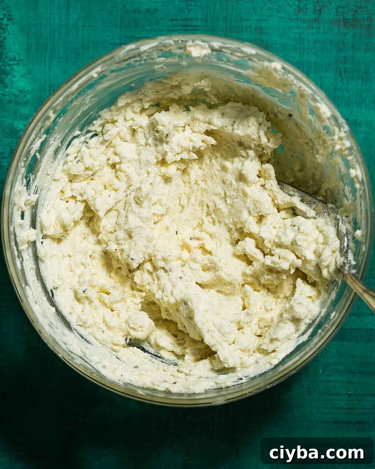 A bowl of blue cheese mixture ready to piped into green olives.