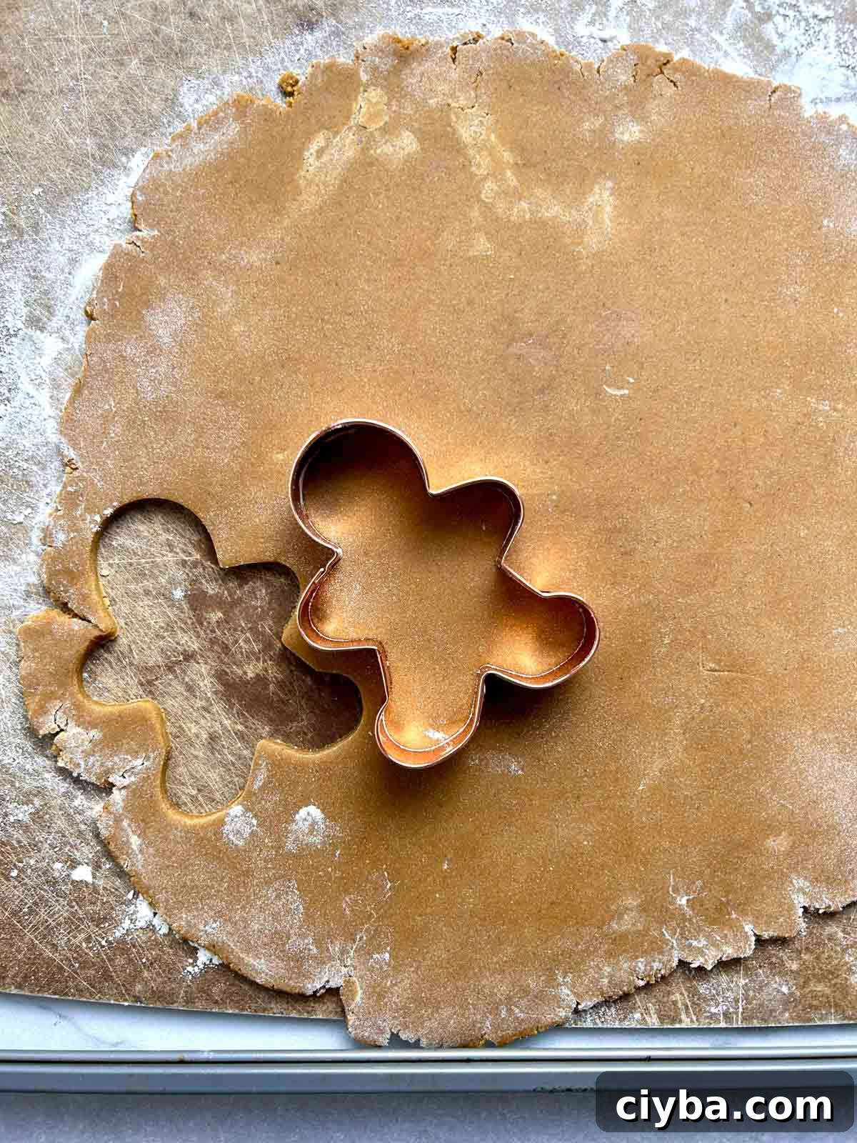 Classic Gingerbread Cookies Recipe for Soft, Spiced Cookies 8 cookie cutter pressed into flattened dough.