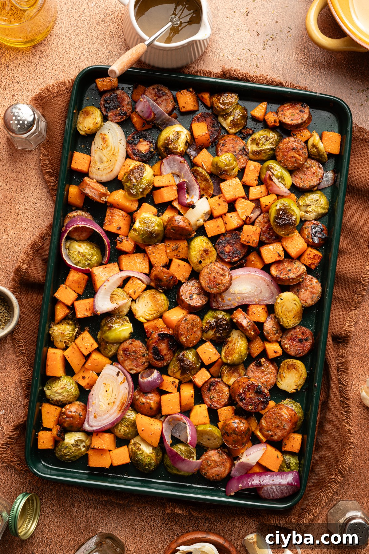 An Autumn sheet pan dinner made with chicken sausage and seasonal veggies