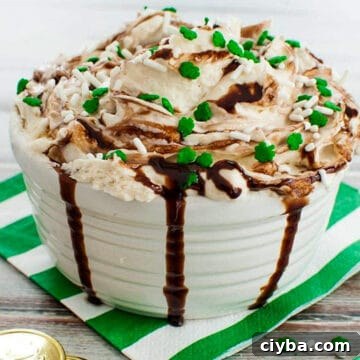 10 Irresistible Baileys Dessert Recipes for St. Patrick’s Day 5 Baileys Irish Cream Dip in a white dish on white and green striped napkin