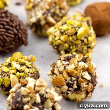 10 Irresistible Baileys Dessert Recipes for St. Patrick’s Day 6 Baileys Irish Cream Chocolate Truffles on a white surface