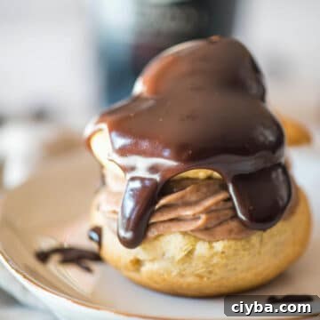 10 Irresistible Baileys Dessert Recipes for St. Patrick’s Day 10 Irish Cream Cream Puffs on a white plate
