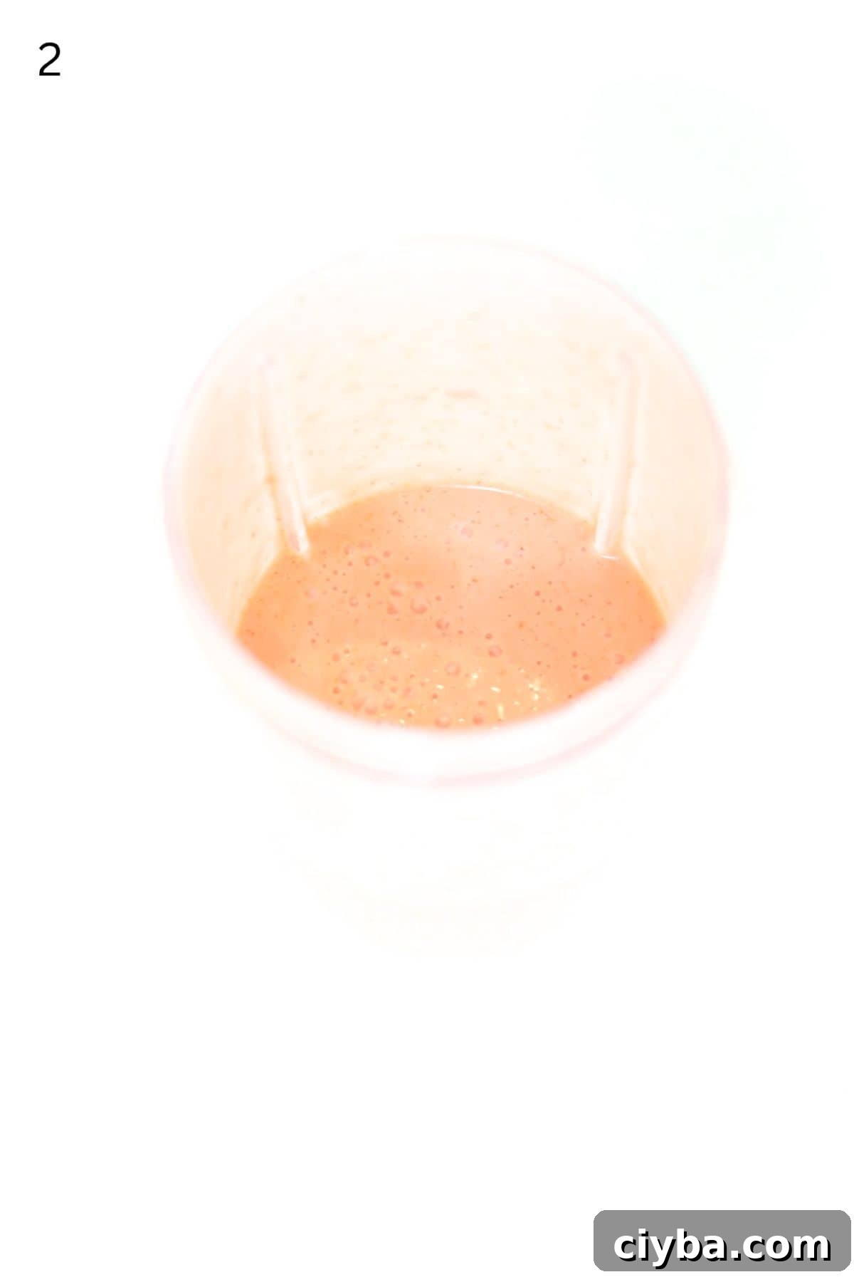 Strawberry salad dressing blended in a Nutri Bullet blender container.