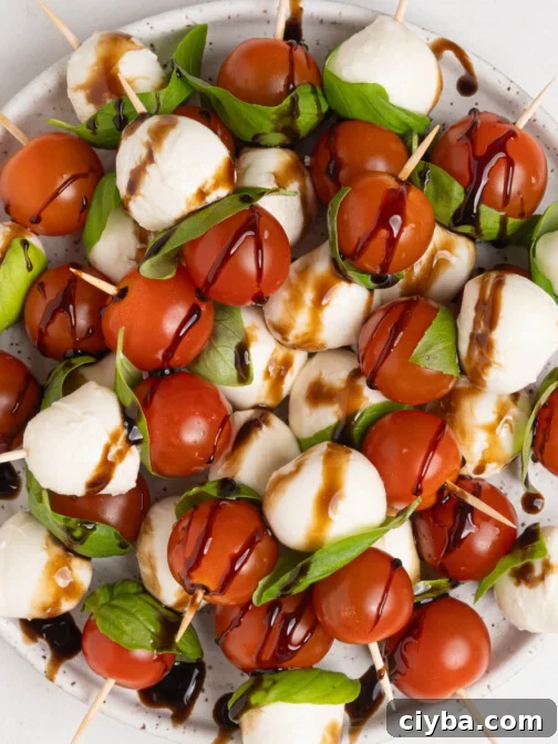 A plate of caprese salad skewers.