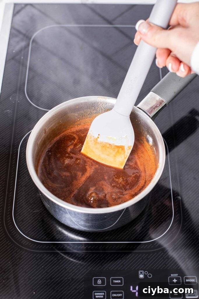 BBQ sauce in a small pan simmering.
