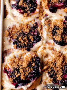 Top view of baked blueberry muffin cinnamon rolls.