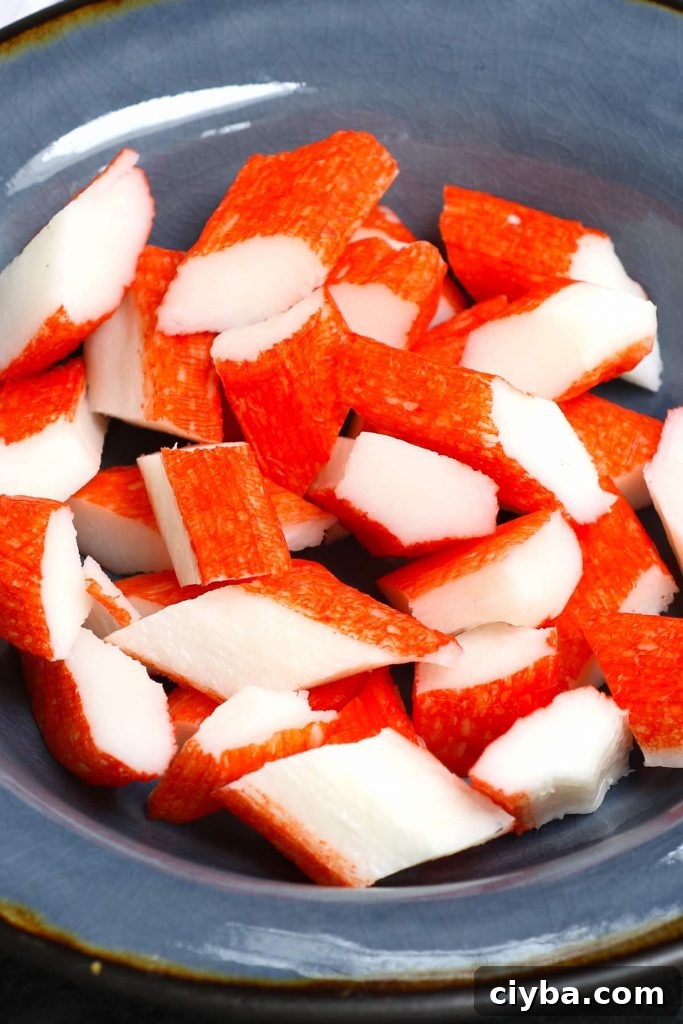 Kanikama chucks in a bowl.