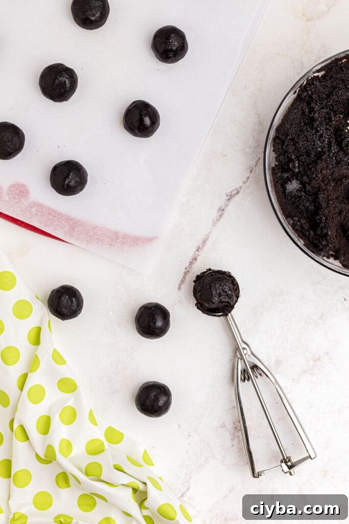 Scoops of Oreo and cream cheese rolled into balls. 