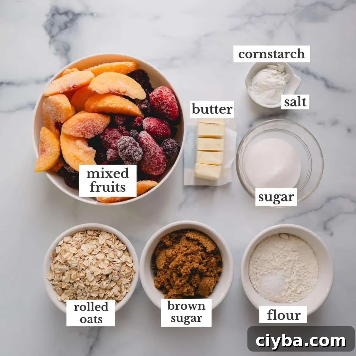 Ingredients needed to make an easy fruit crisp recipe with mixed fruits.