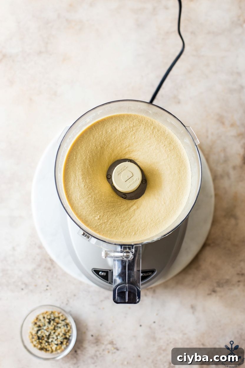 Overhead photo of a food processor of hummus