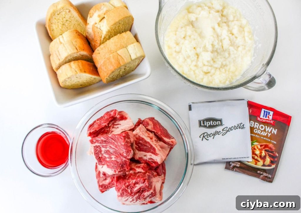 garlic bread, a mixing bowl filled with mashed potatoes, vinegar, raw beef, french onion soup mix, and a brown gravy packet