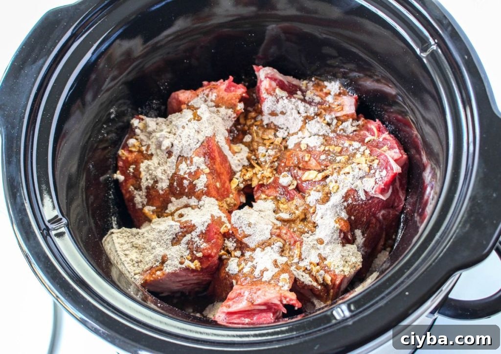 raw beef, gravy and onion soup mix in a slow cooker