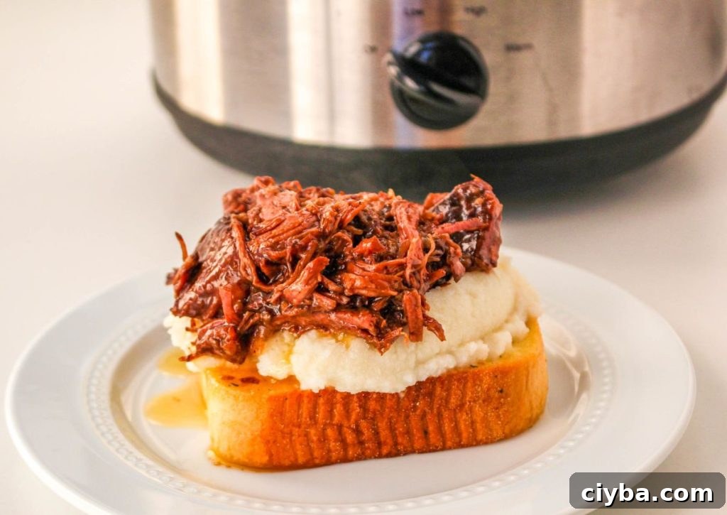 beef manhattan being assembled on a white plate 