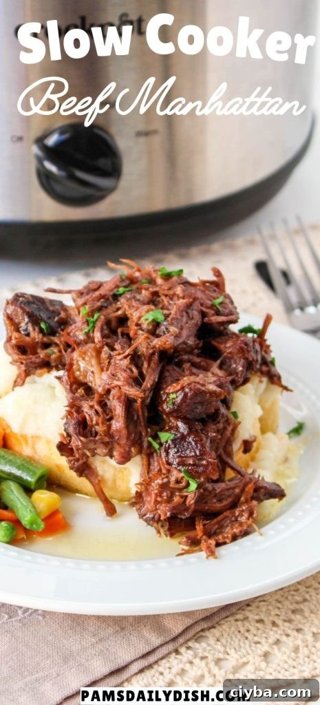 beef manhattan on a white plate with a side of cooked mixed vegetables