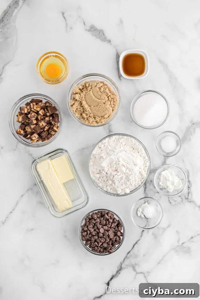 Ingredients needed - butter, brown sugar, flour, soda, cornstarch, vanilla, egg, salt, chocolate chips, snicker bars