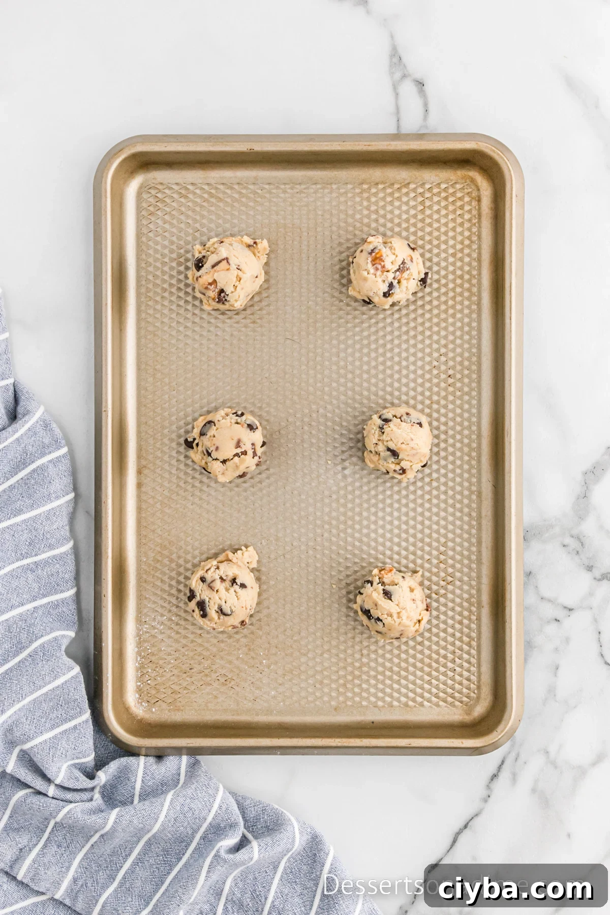Cookie Dough scooped on baking sheet.