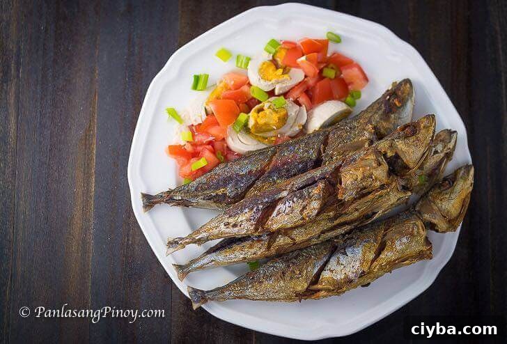 Fried Galunggong with salted egg and tomato salad