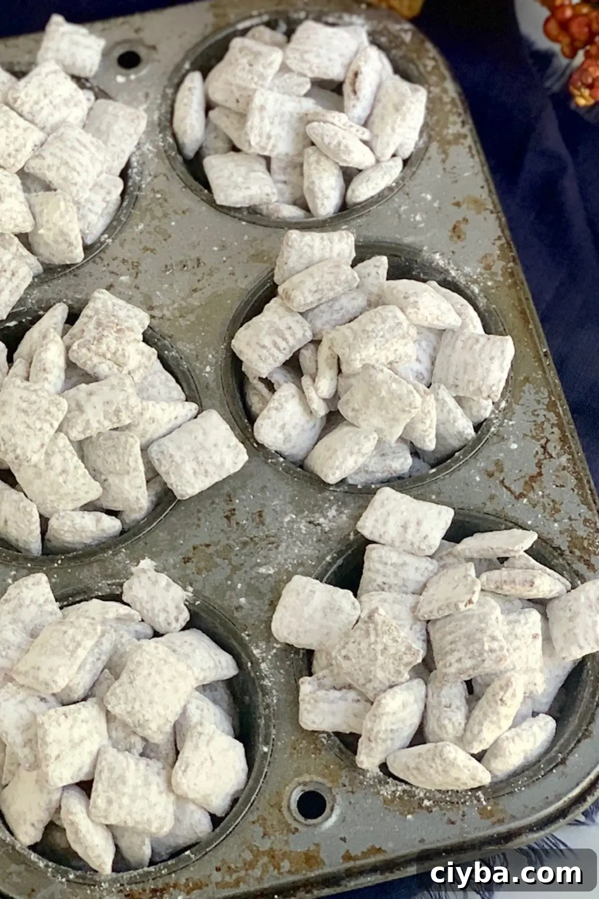 Gluten and Dairy-Free Puppy Chow Recipe for Homemade Treats 4 A baking pan with gluten free dairy free muddy buddies.