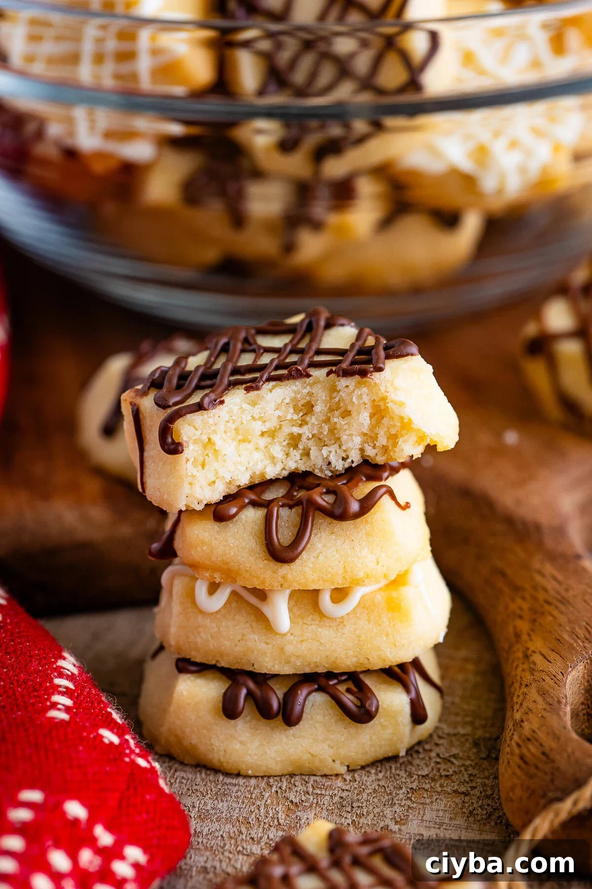 christmas shortbread bites stacked with a bite taken out
