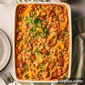 One-Pan Chorizo and Rice Bake: Dump, Bake, Serve 9 An oven dish with a one pan chorizo rice, a new dump and bake recipe from Taming Twins, on a table.
