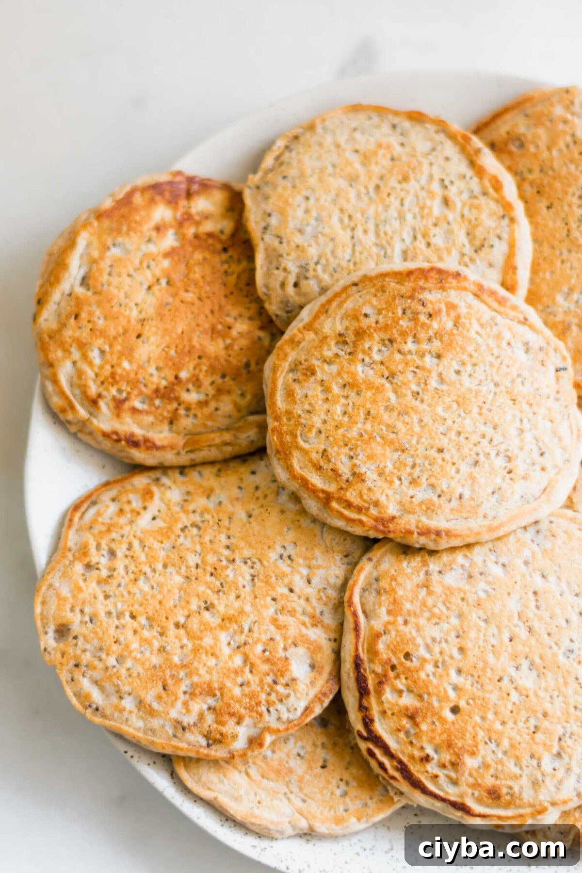 Plate of fluffy vegan chia seed pancakes.
