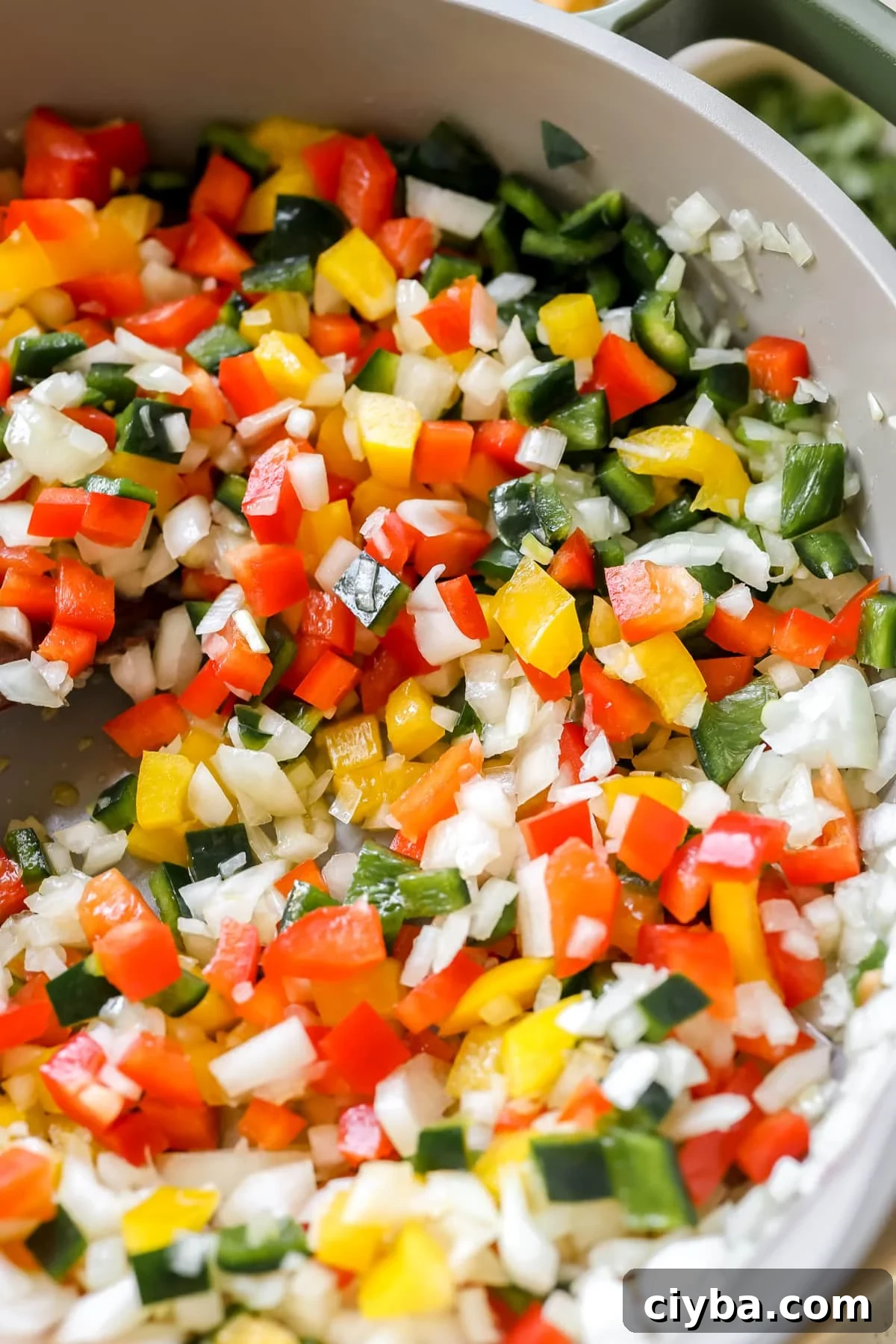 bell peppers and onions in a skillet.