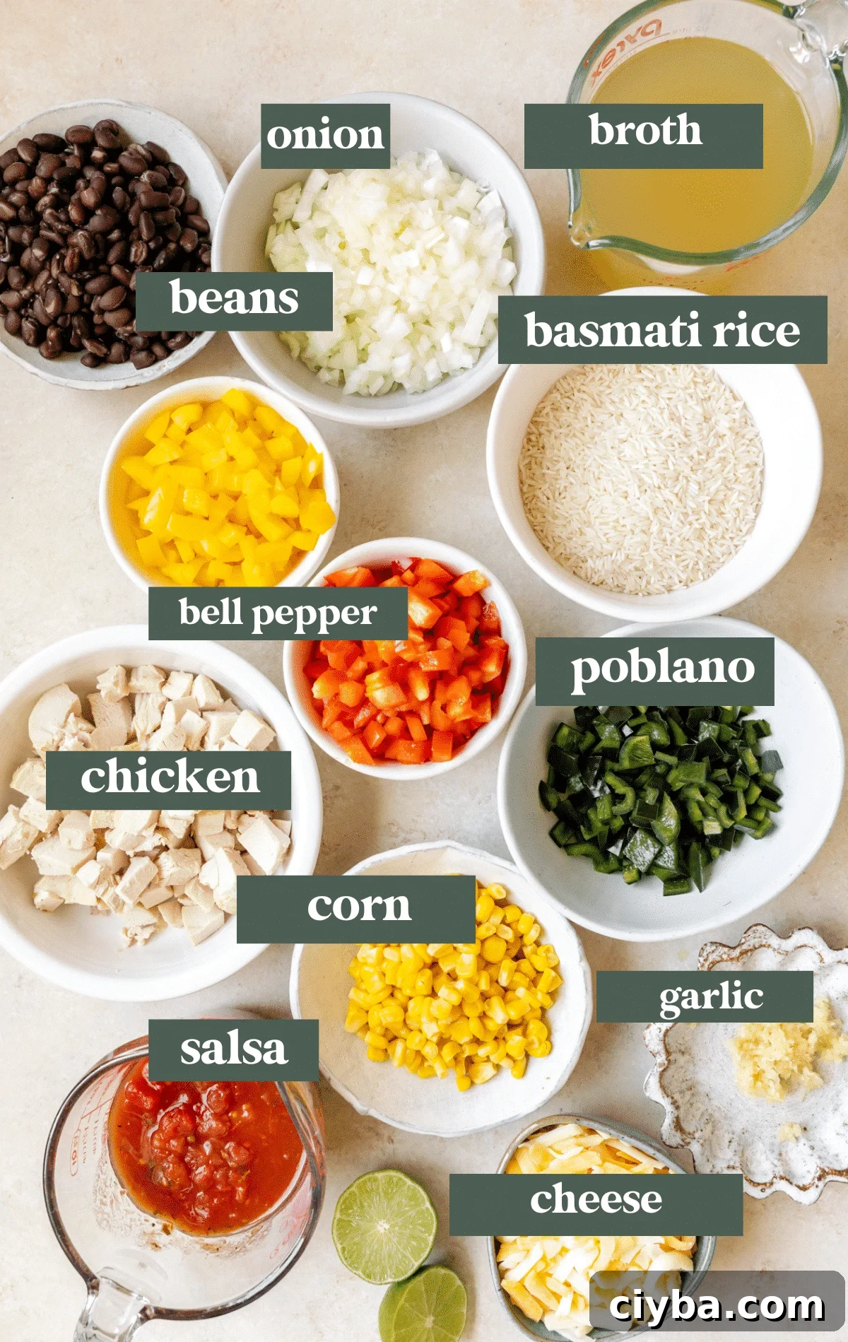 ingredients in white glass bowls needed to make chicken rice bowls.