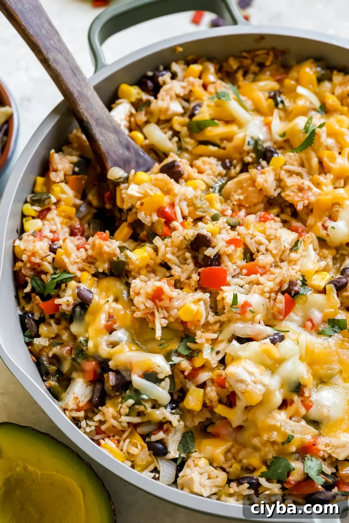 chicken, rice and cheese in a skillet.