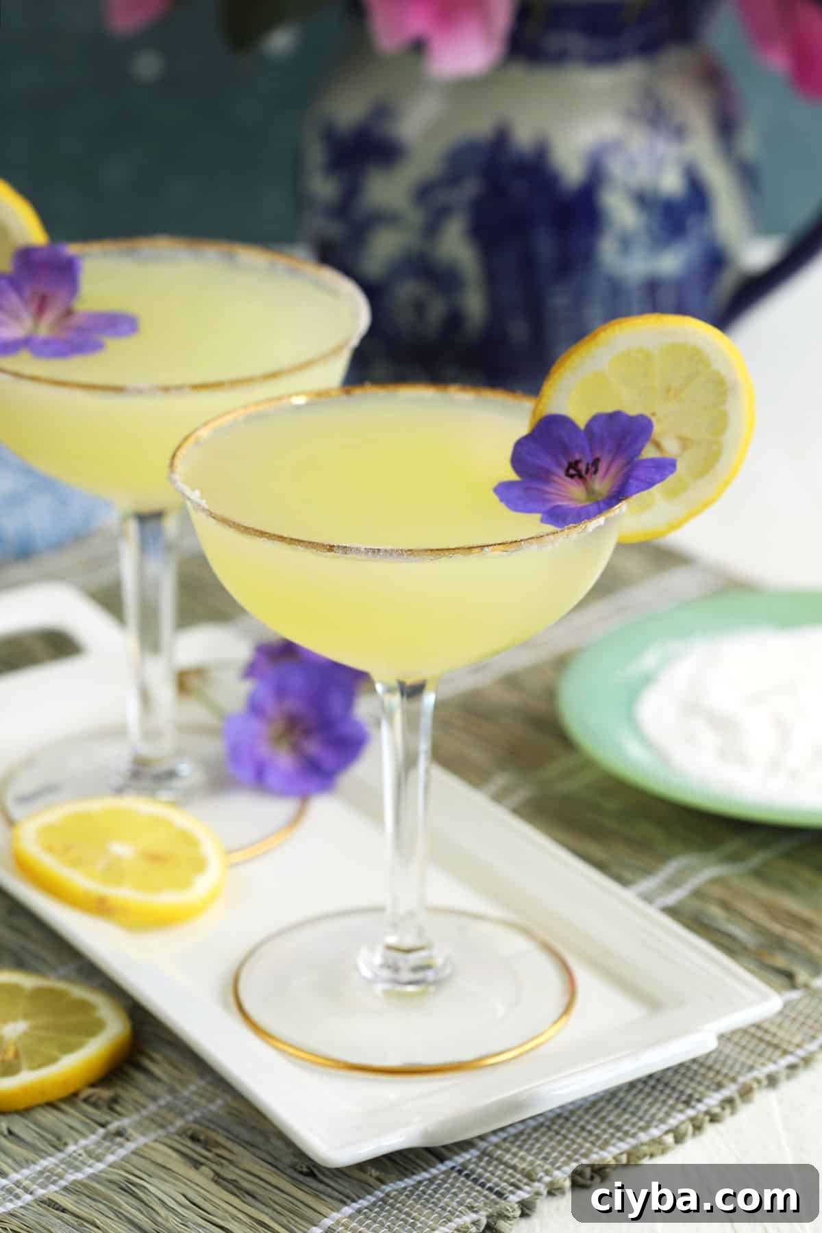 Edible purple flowers garnish martinis. 