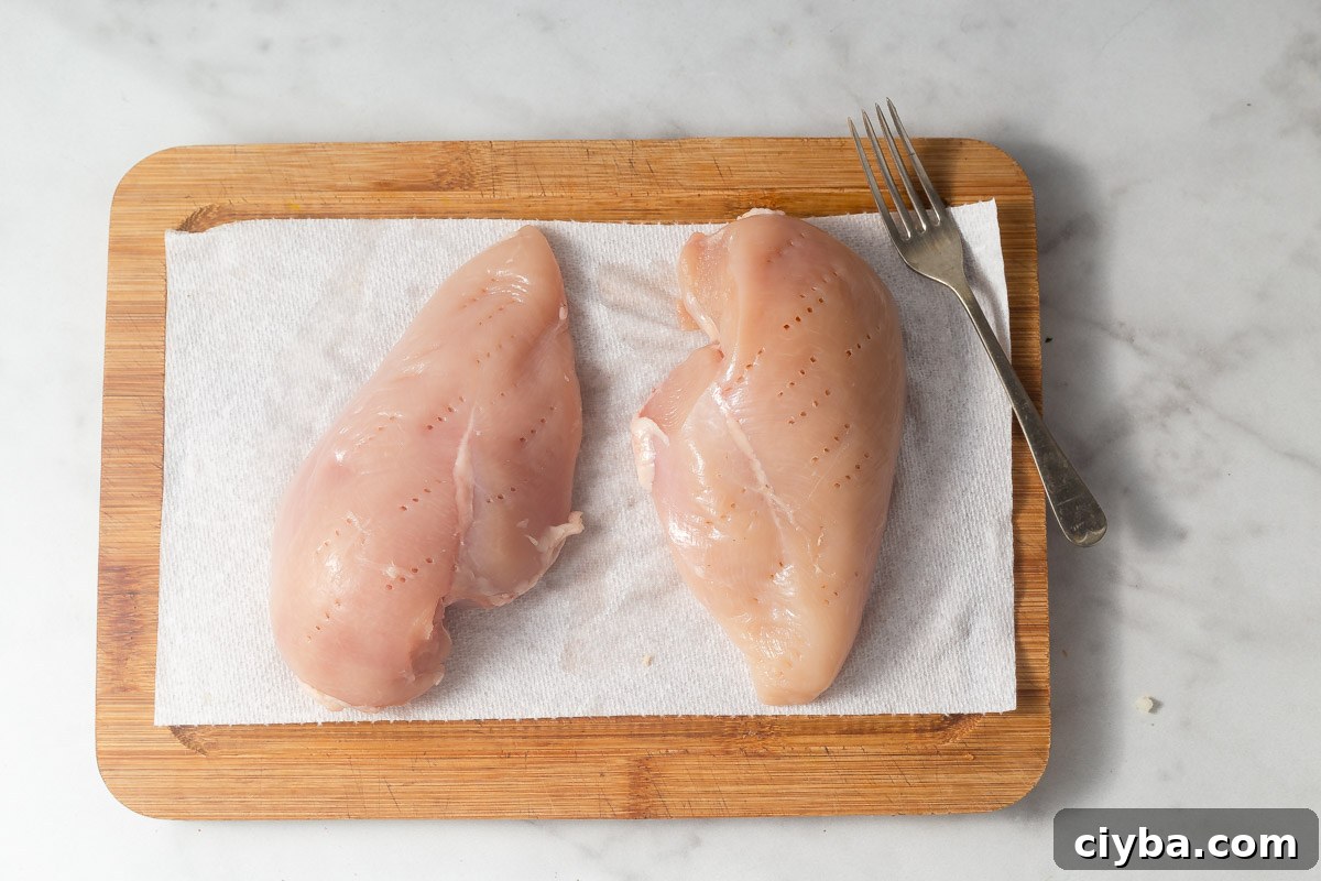 pricking the chicken  breast