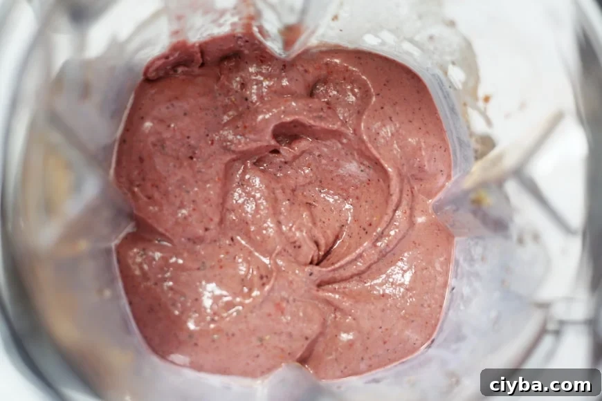Overhead shot of the superfood berry smoothie bowl in the blender container