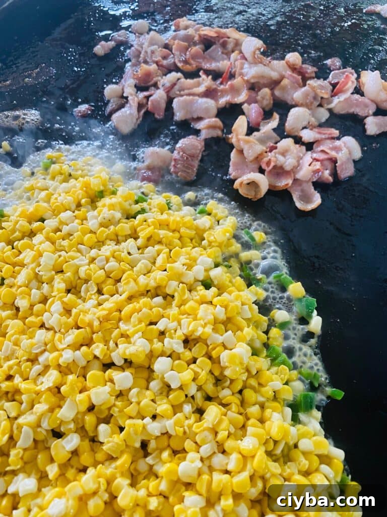 Blackstone Shrimp with Bacon and Grilled Corn 4 Adding corn and shrimp to the griddle