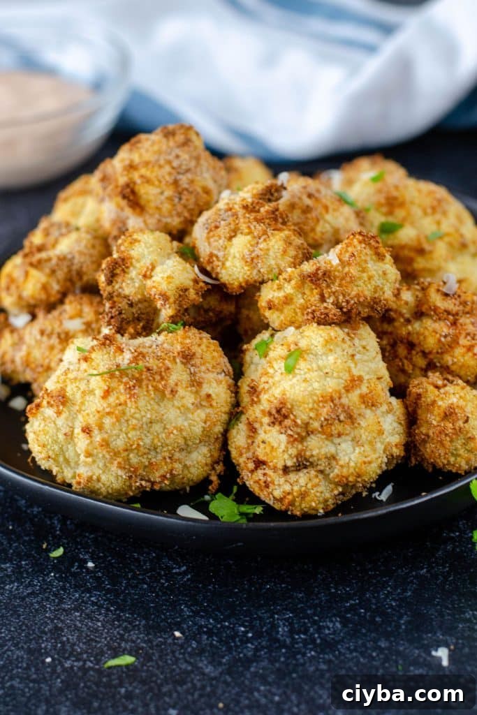 Golden brown crispy breaded cauliflower on a plate