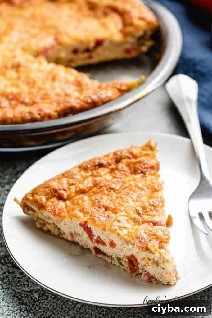 An aerial view of a slice of the finished crustless quiche.