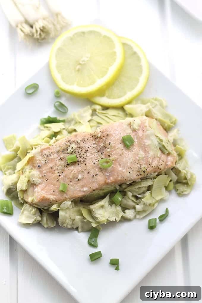 Lemon Artichoke Baked Salmon - a heart-healthy dinner packed full of flavour and nutrition with only two steps required, marinate and bake!