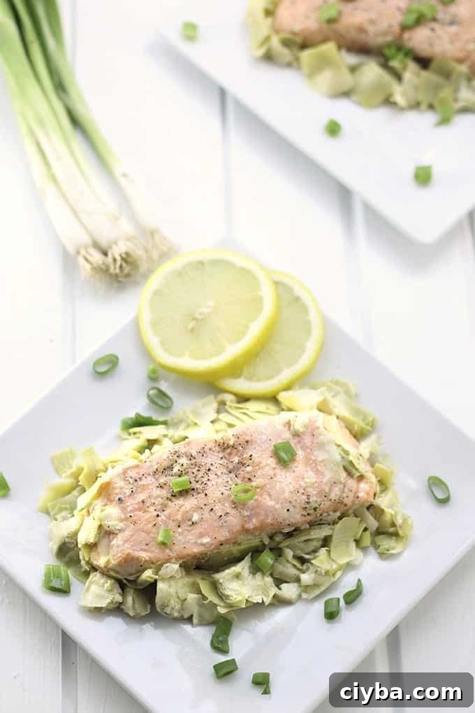 Lemon Artichoke Baked Salmon - a heart-healthy dinner packed full of flavour and nutrition with only two steps required, marinate and bake!