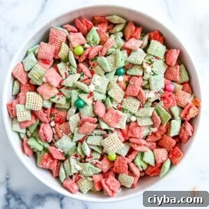 Bowl with candy coated cereal with sprinkles and other small festive candies on top.