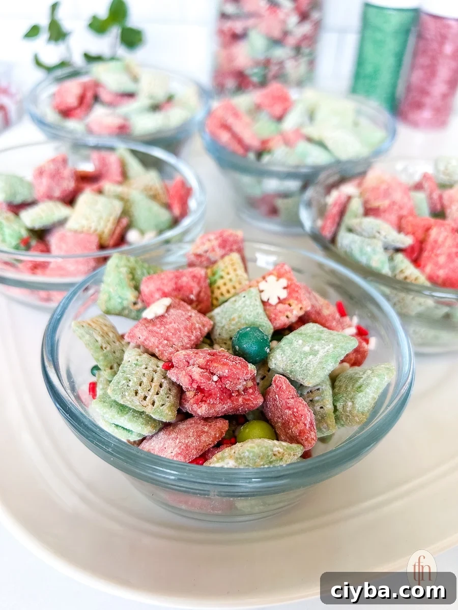 Five small glass bowls filled with sweet holiday snack mix.