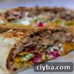 pulled pork crunch wrap supreme cut in half